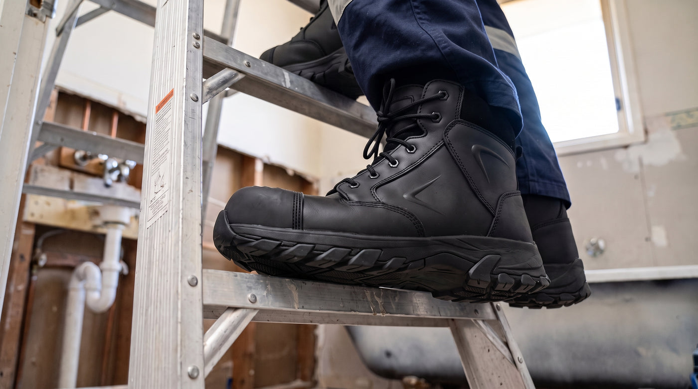 Helium Black boots supporting a plumber on a ladder